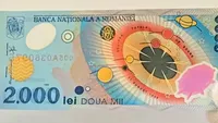Cât se oferă acum pe bancnota de 2.000 de lei cu eclipsa din 1999. Unele exemplare ajung la sume colosale