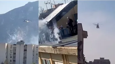 Momentul tulburător când un elicopter al poliției este atacat cu artificii de petrecăreții de pe un bloc - VIDEO