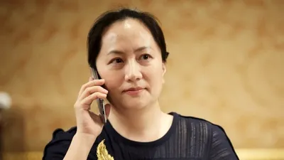 Moştenitoarea „tronului” Huawei avea laptop, telefon şi tabletă Apple în posesie în momentul arestării