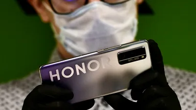 Declinul Huawei: Compania, lovită de sancțiunile SUA, va vinde afacerea Honor